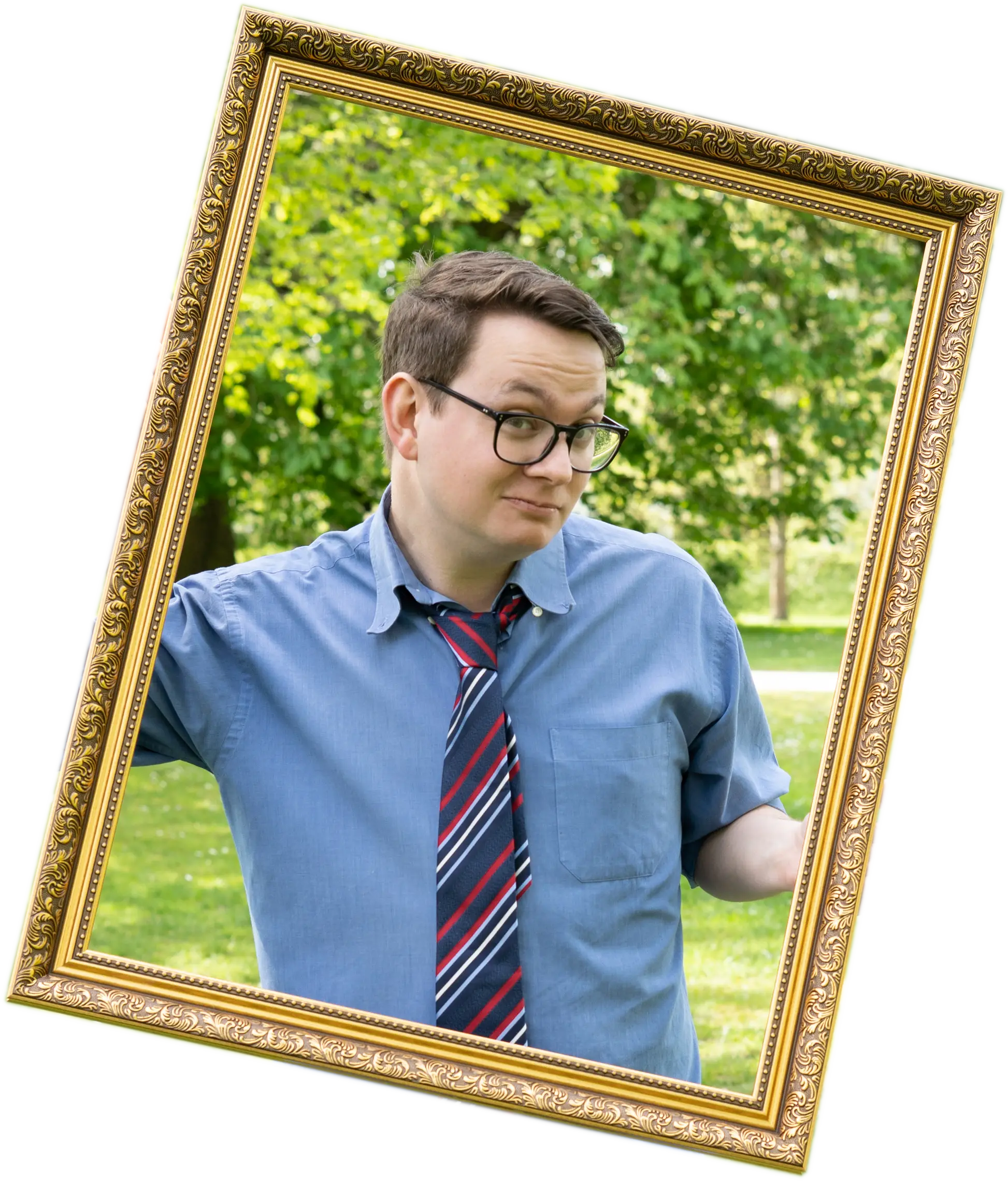 A white man with brown hair in a blue shirt and striped tie